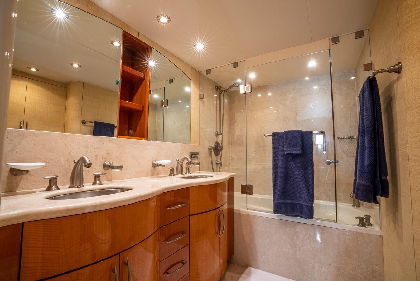 a bathroom with a large mirror aboard COMPROMISE Yacht for Sale