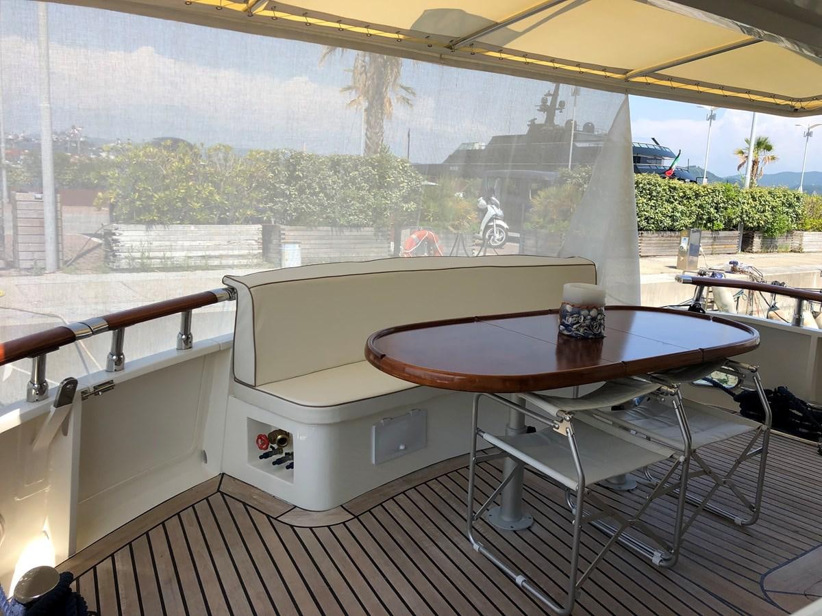 a table and a chair on a balcony aboard ORION  Yacht for Sale