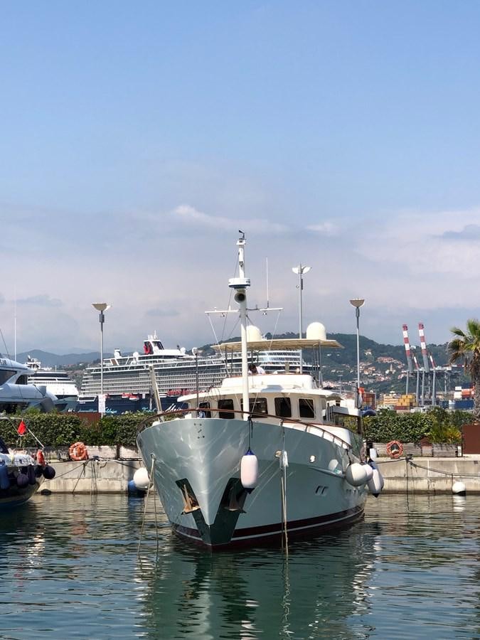 a boat docked at a pier aboard ORION  Yacht for Sale