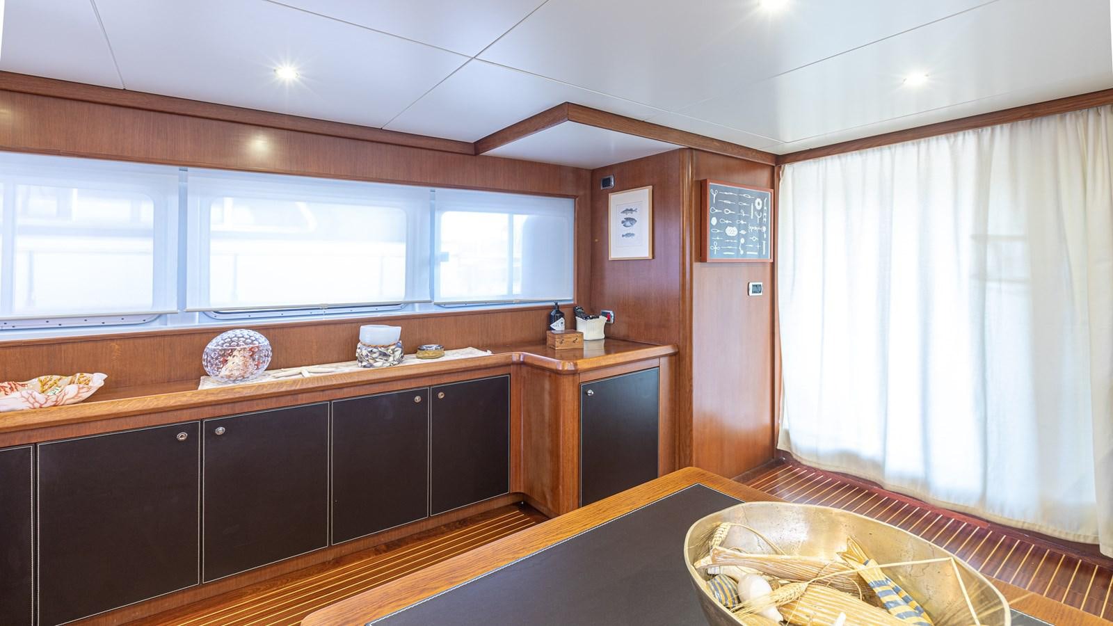 a kitchen with a table and a window aboard ORION  Yacht for Sale