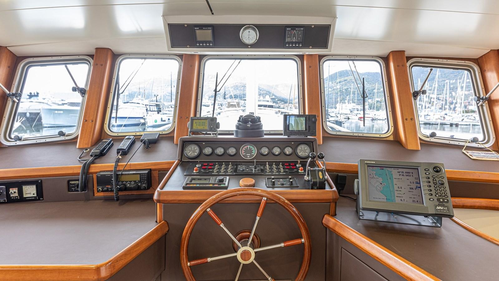 a wooden boat with a radio and a radio aboard ORION  Yacht for Sale