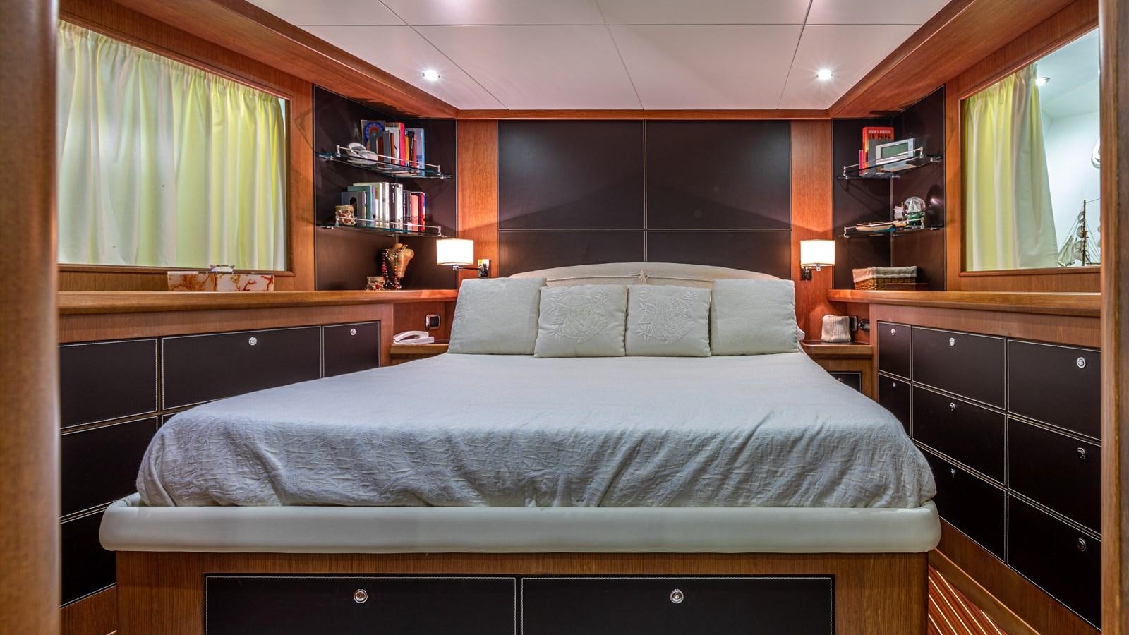 a bed in a room aboard ORION  Yacht for Sale