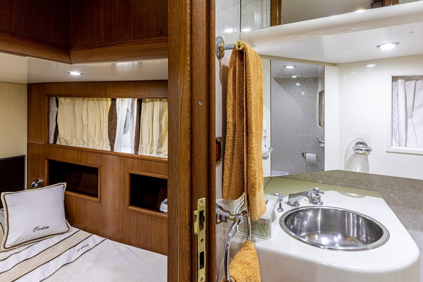 a bathroom with a sink and a mirror aboard ORION  Yacht for Sale