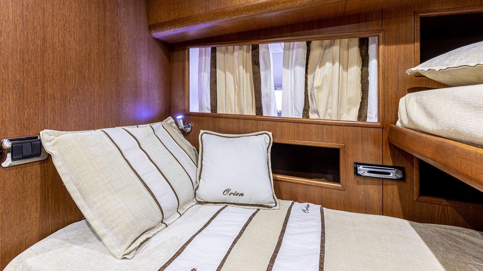 a bed with white sheets aboard ORION  Yacht for Sale