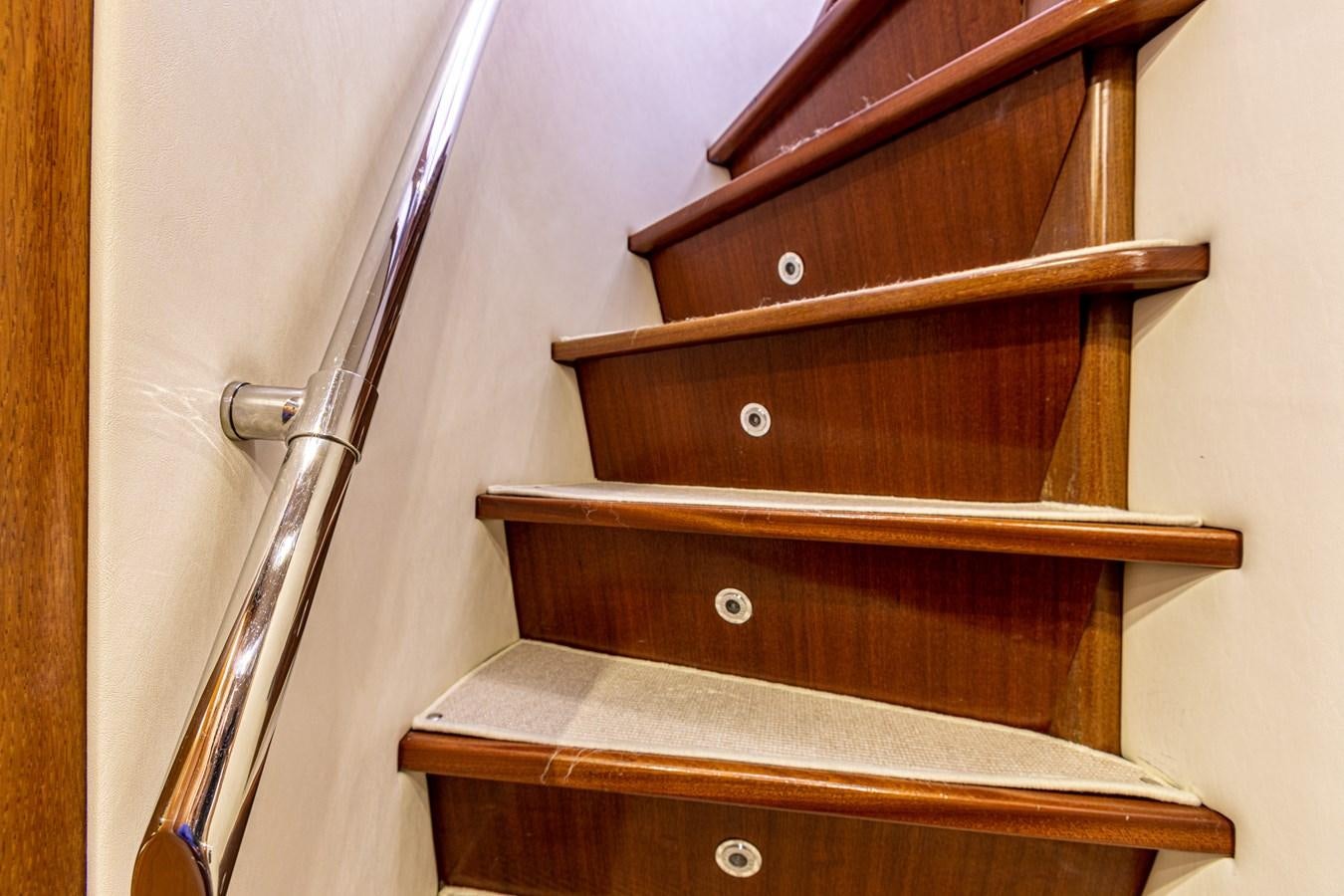 a wooden shelf with a metal rod aboard ORION  Yacht for Sale
