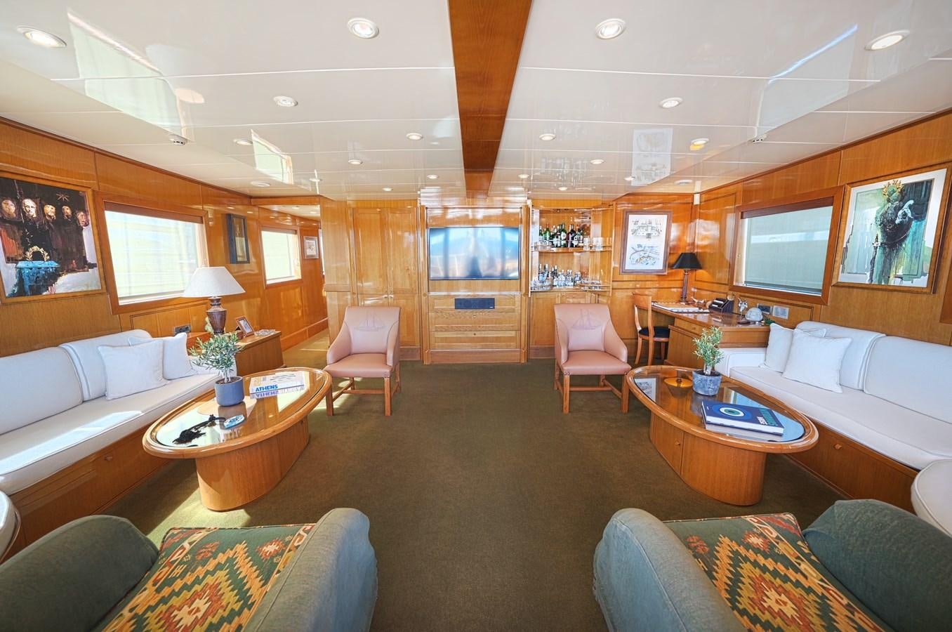 a living room with a large screen aboard ARKTOS Yacht for Sale