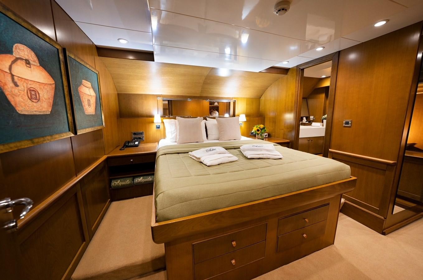 a bed in a room aboard ARKTOS Yacht for Sale