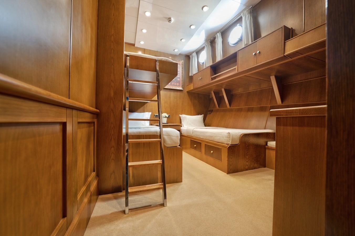 a room with wooden bunk beds aboard ARKTOS Yacht for Sale