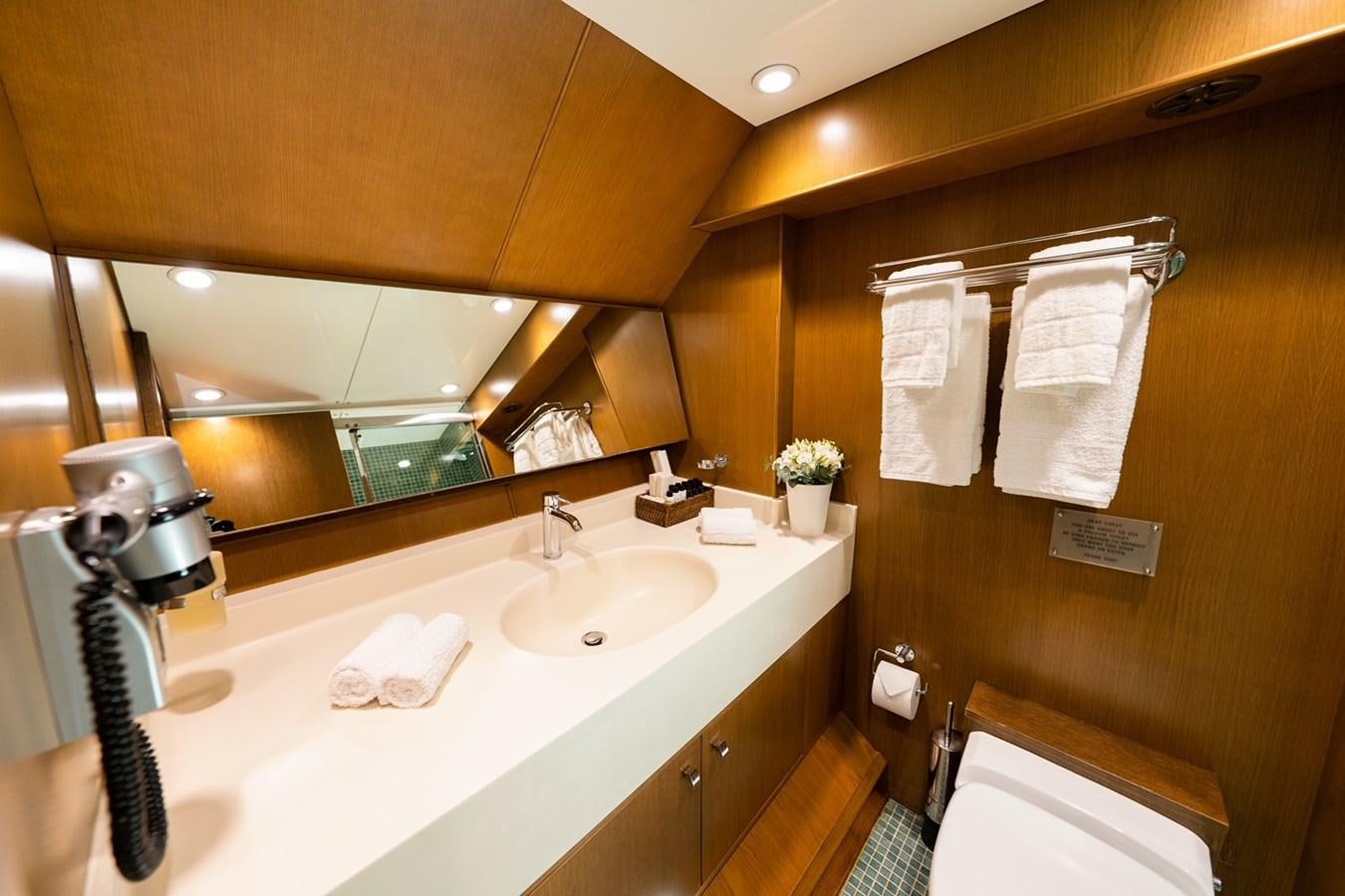 a bathroom with a sink and a mirror aboard ARKTOS Yacht for Sale