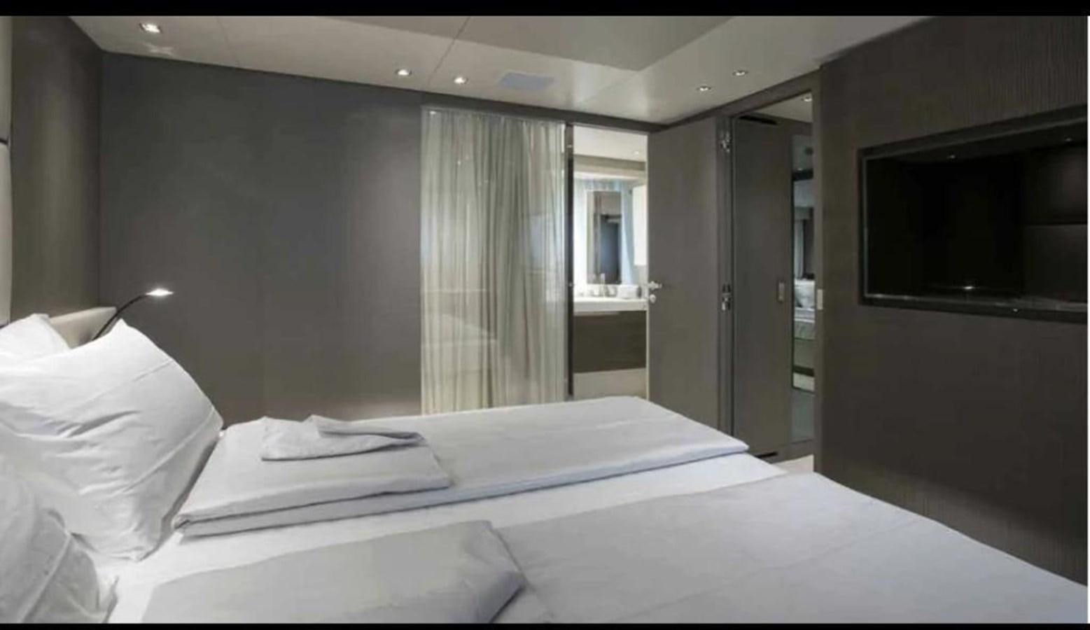 a hotel room with a bed aboard MUMA Yacht for Sale