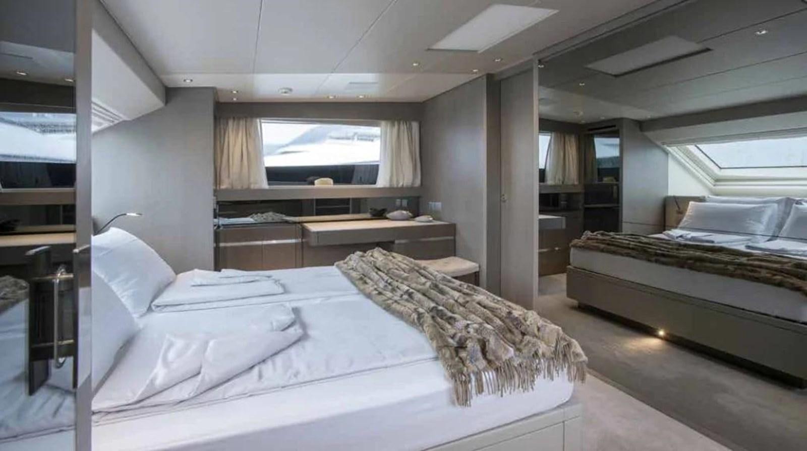 a room with a bed and a desk aboard MUMA Yacht for Sale