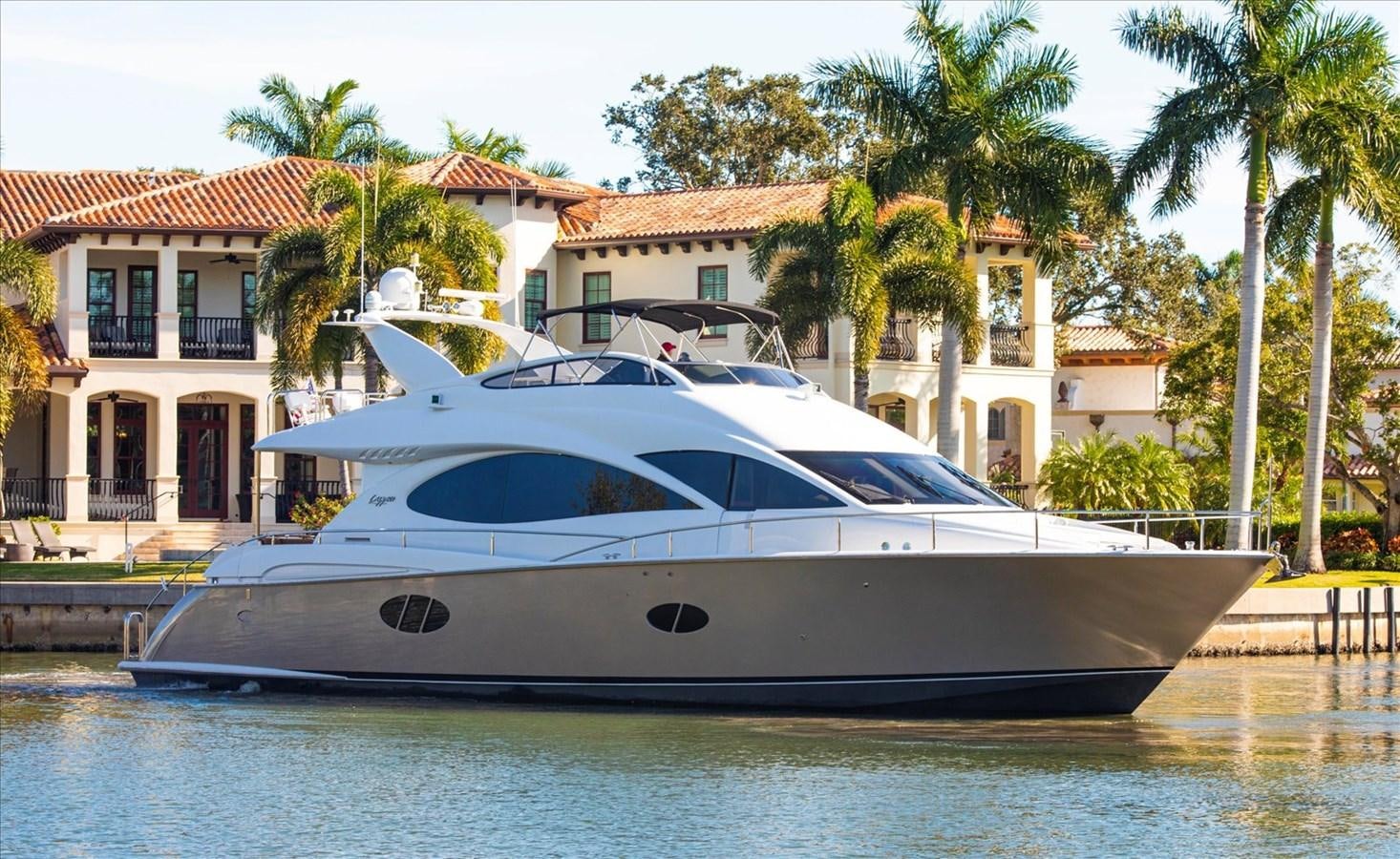 a white yacht in a tropical setting aboard GOLDEN LADY Yacht for Sale