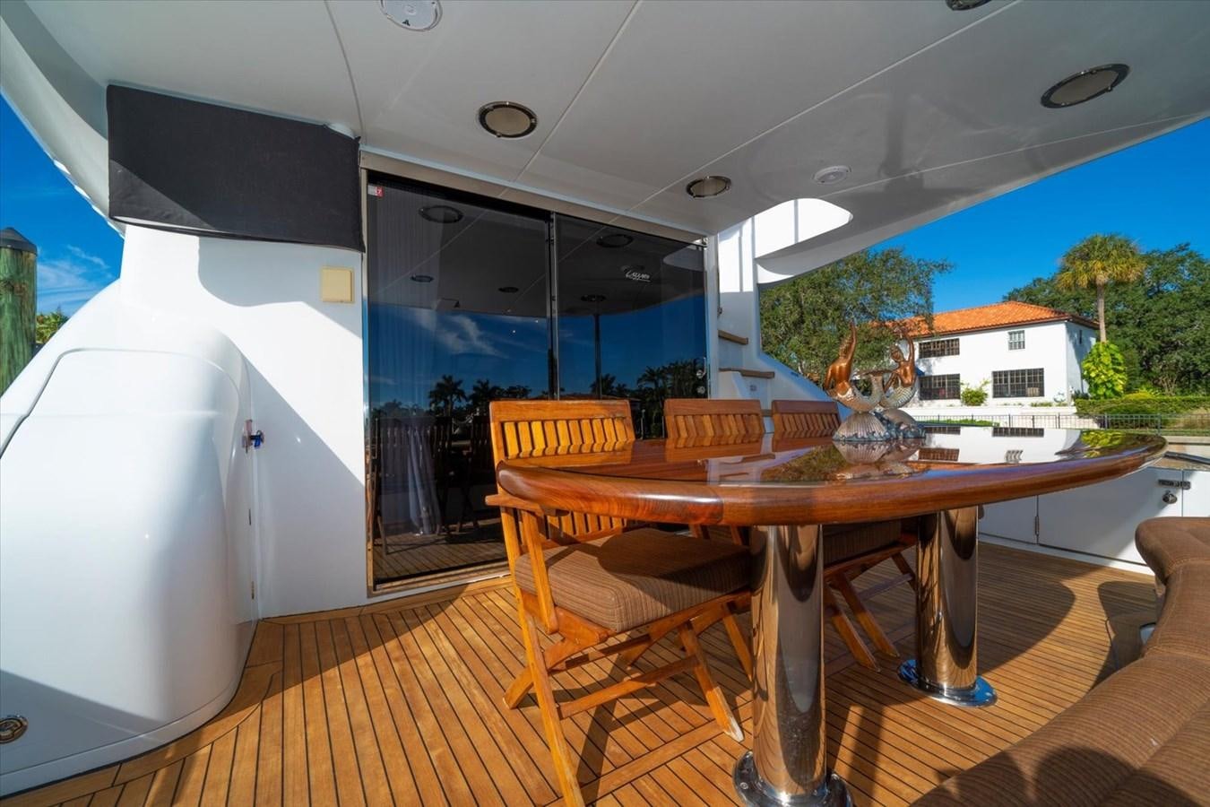 a table and chairs on a deck aboard GOLDEN LADY Yacht for Sale