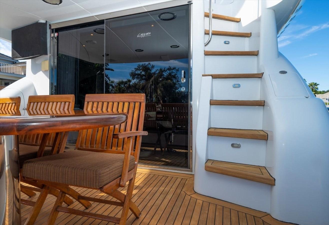 a boat with a bench and chairs aboard GOLDEN LADY Yacht for Sale