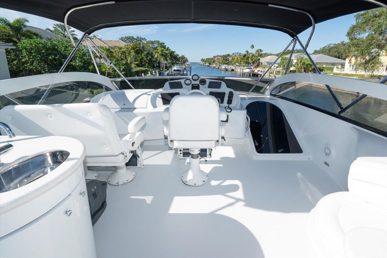 a white car with a chair on the seat aboard GOLDEN LADY Yacht for Sale