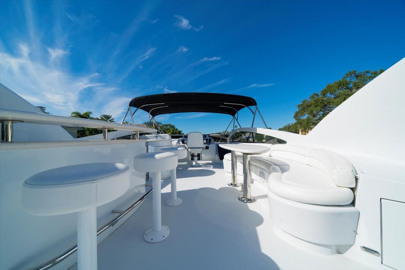 a group of white chairs aboard GOLDEN LADY Yacht for Sale