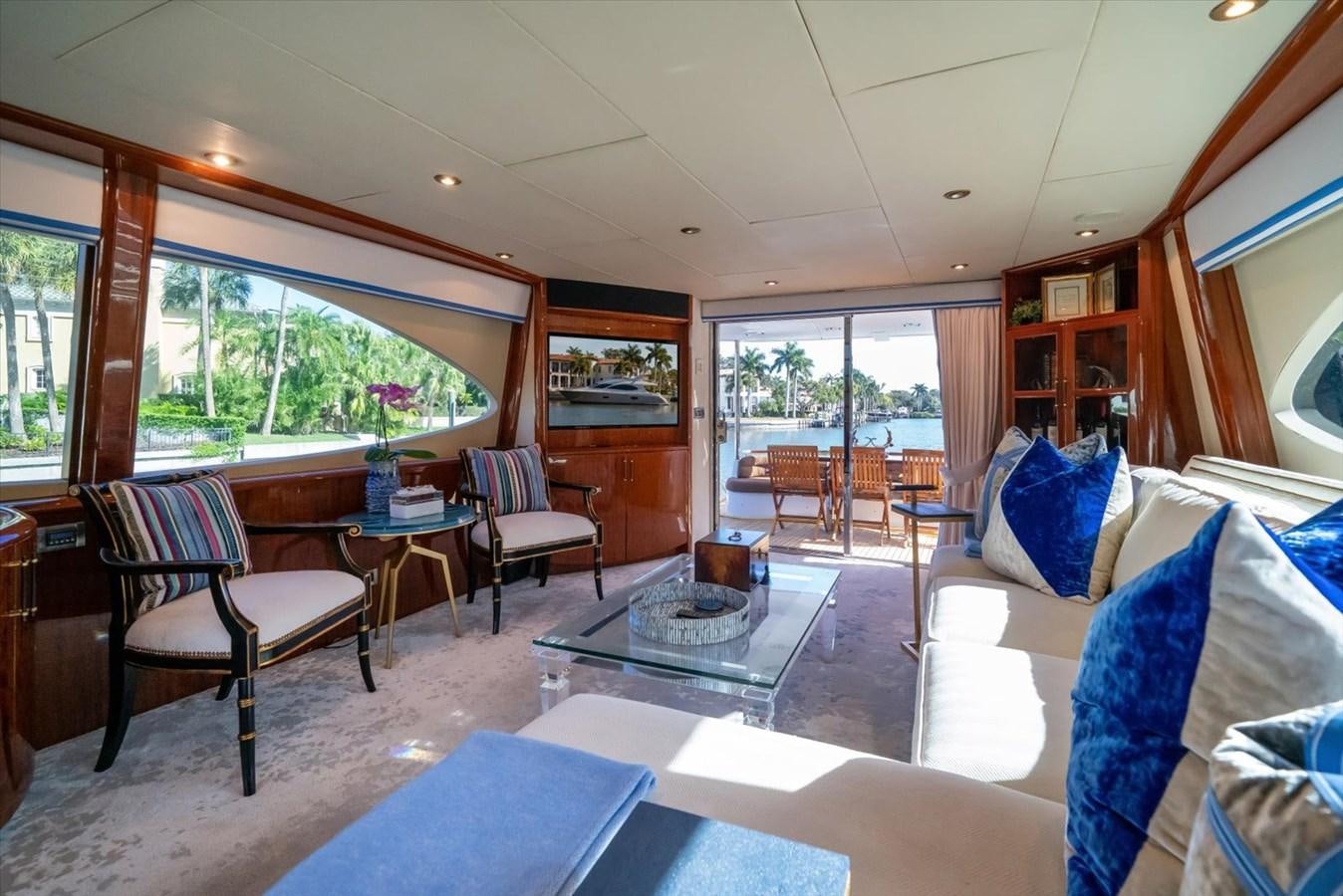 a living room with a large window aboard GOLDEN LADY Yacht for Sale