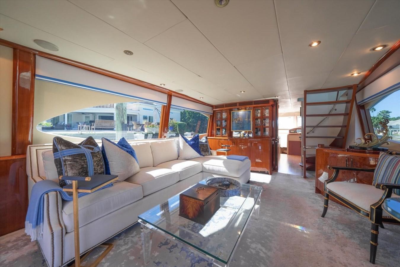 a living room with a large window aboard GOLDEN LADY Yacht for Sale