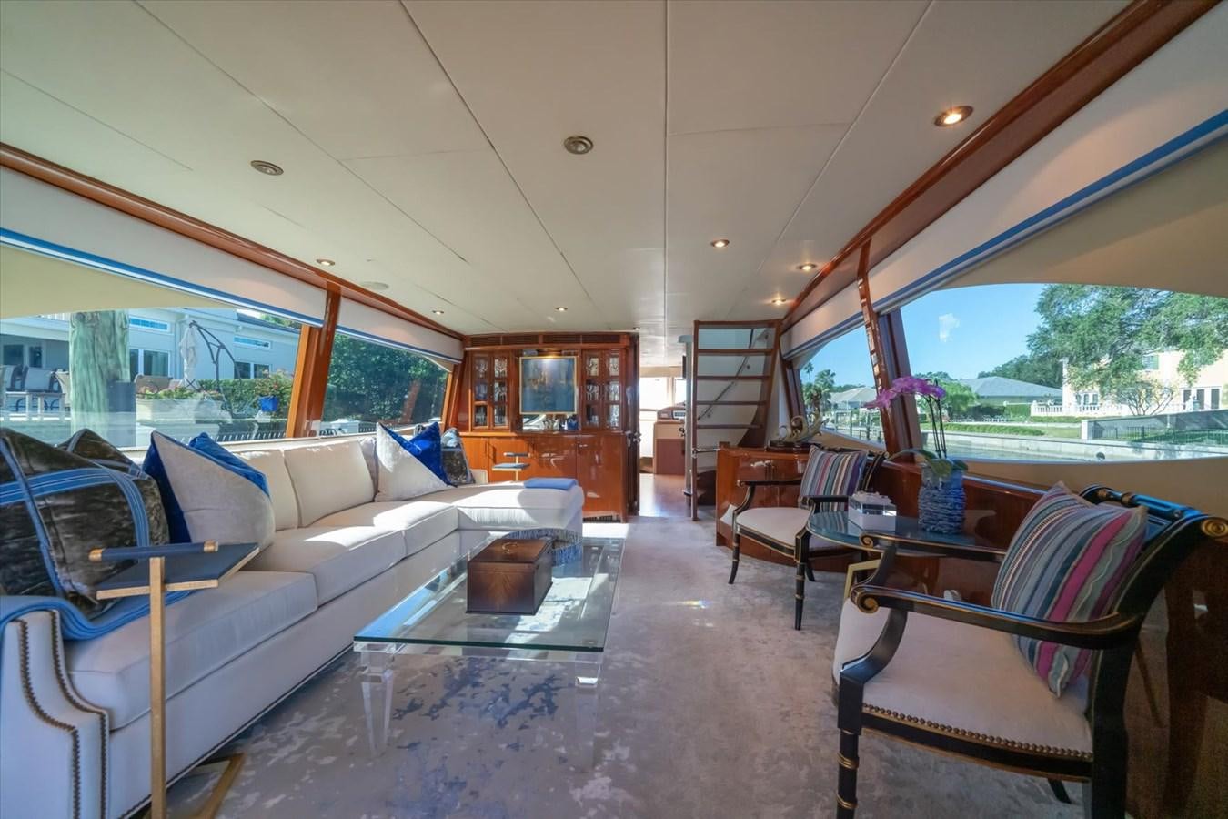 a living room with a couch and a table aboard GOLDEN LADY Yacht for Sale
