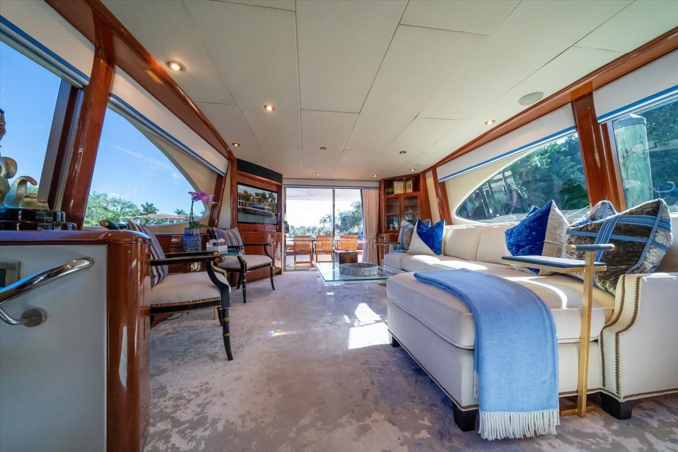 a room with a bed and a chair aboard GOLDEN LADY Yacht for Sale