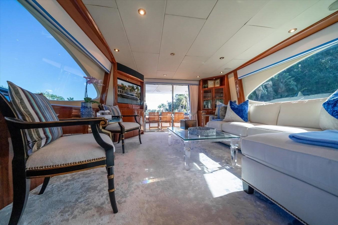 a living room with a couch and a table aboard GOLDEN LADY Yacht for Sale