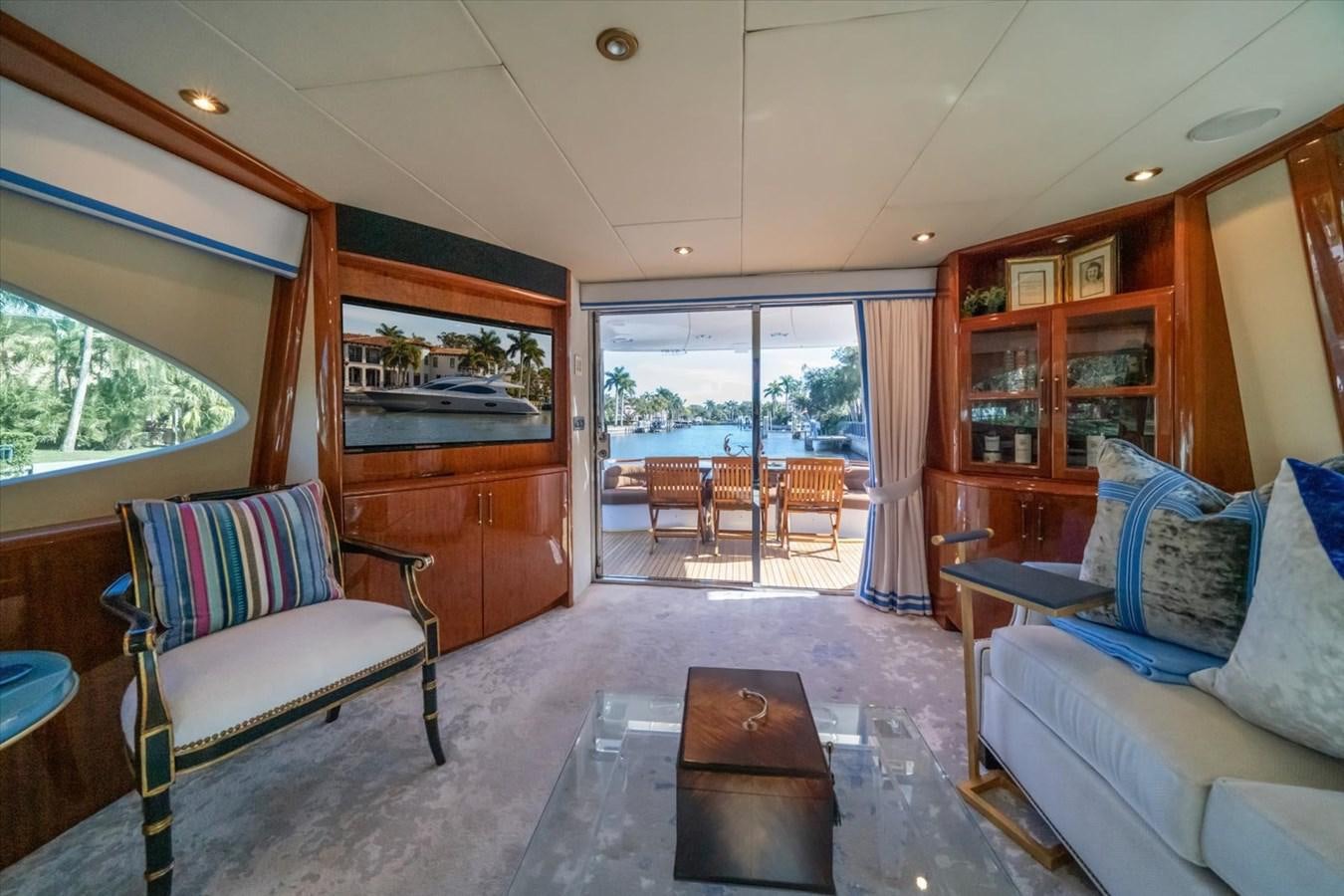a living room with a couch and a table aboard GOLDEN LADY Yacht for Sale