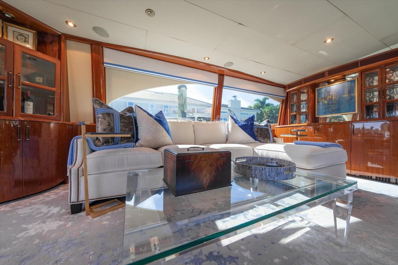 a living room with a glass table aboard GOLDEN LADY Yacht for Sale