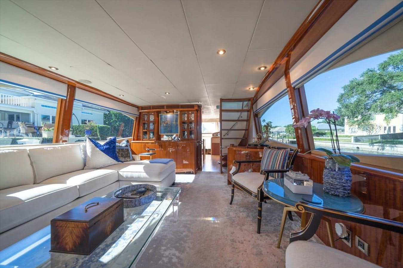 a living room with a couch and a table aboard GOLDEN LADY Yacht for Sale