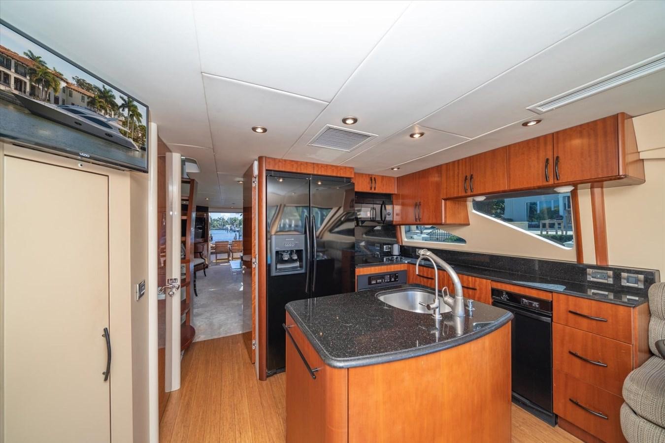 a kitchen with a black counter top aboard GOLDEN LADY Yacht for Sale