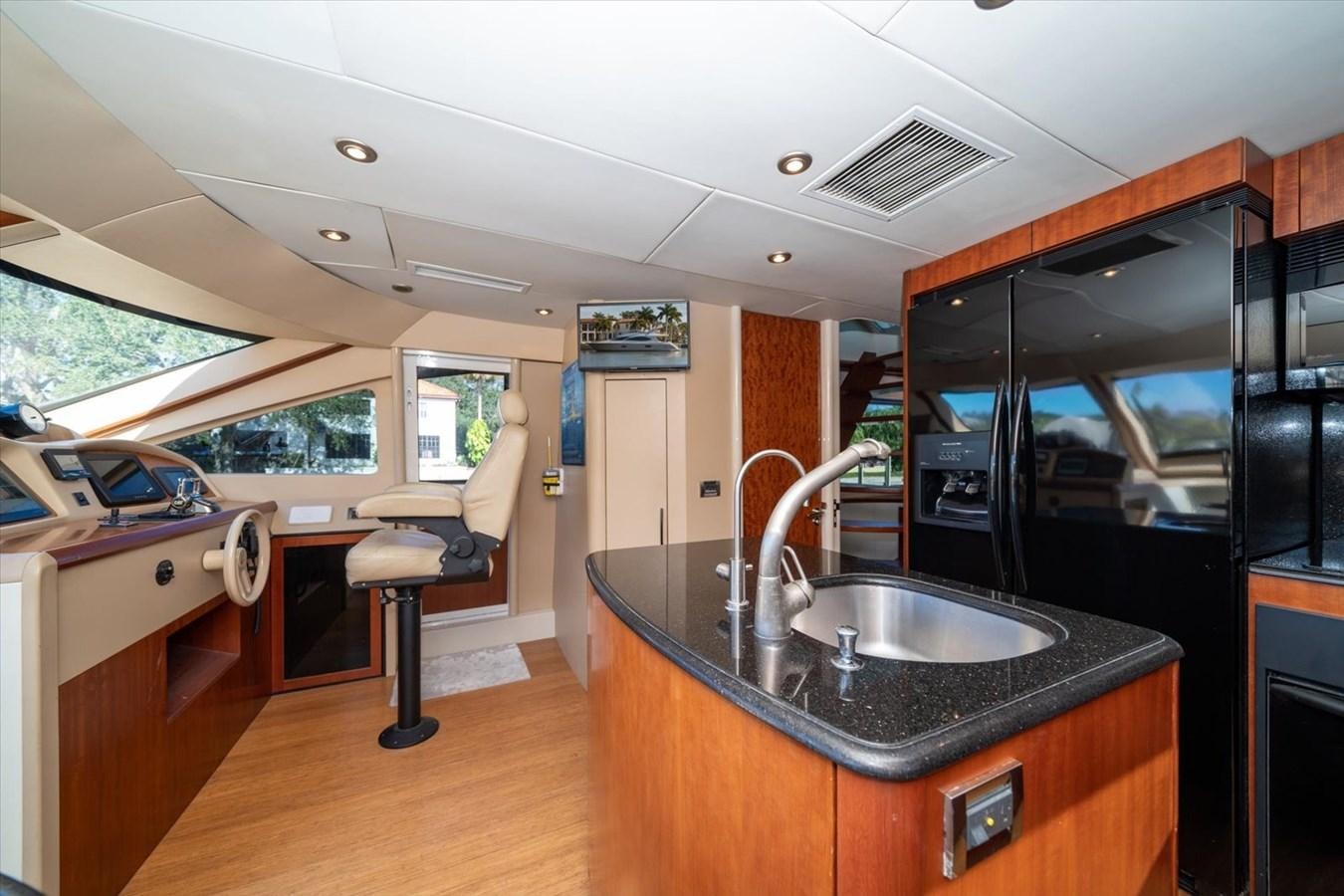 a kitchen with a sink and a refrigerator aboard GOLDEN LADY Yacht for Sale