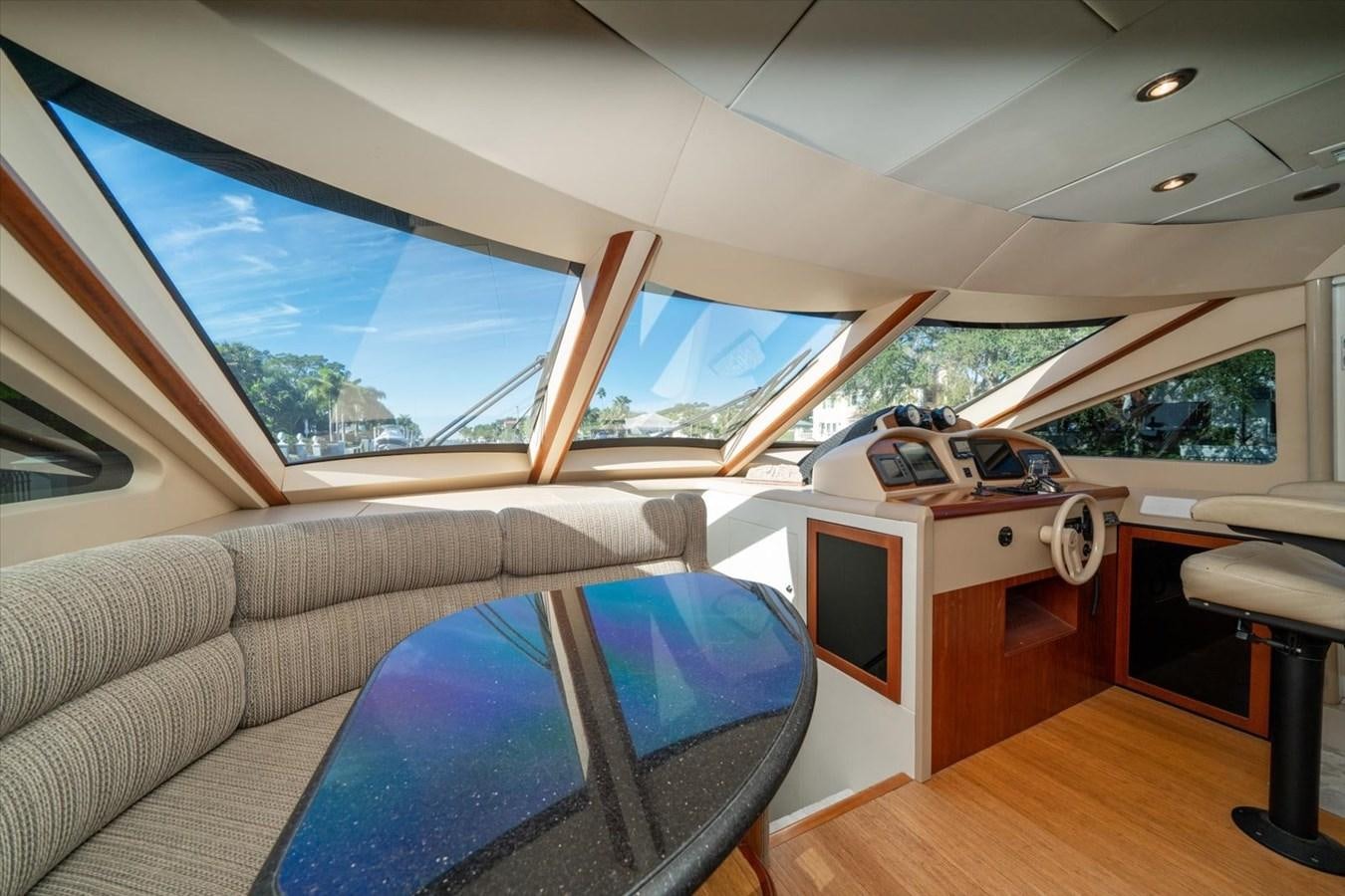 a room with a couch and a television aboard GOLDEN LADY Yacht for Sale