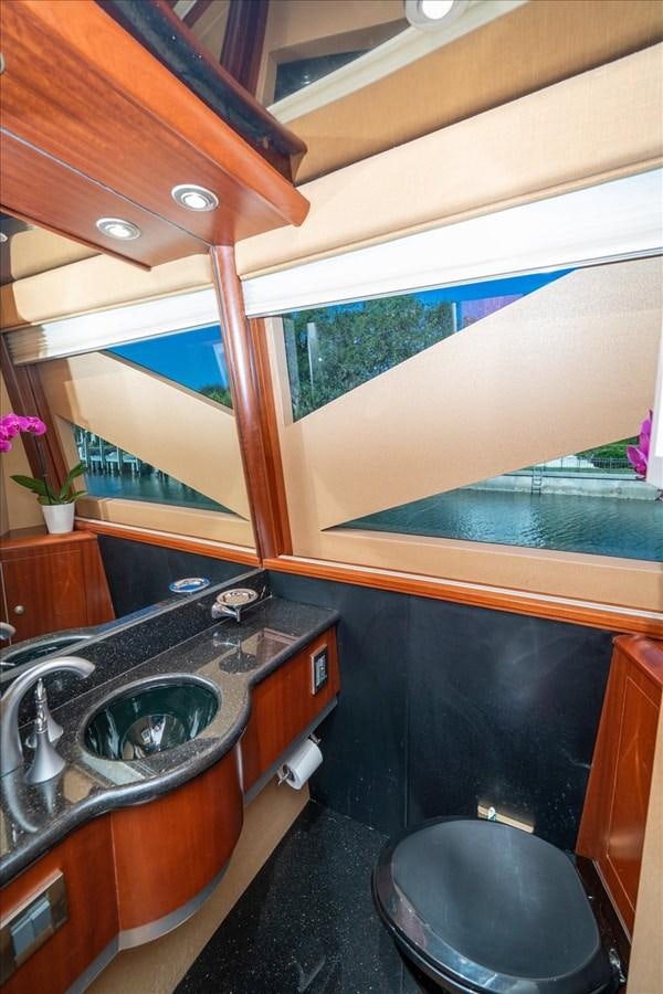 a bathroom with a sink and a large window aboard GOLDEN LADY Yacht for Sale