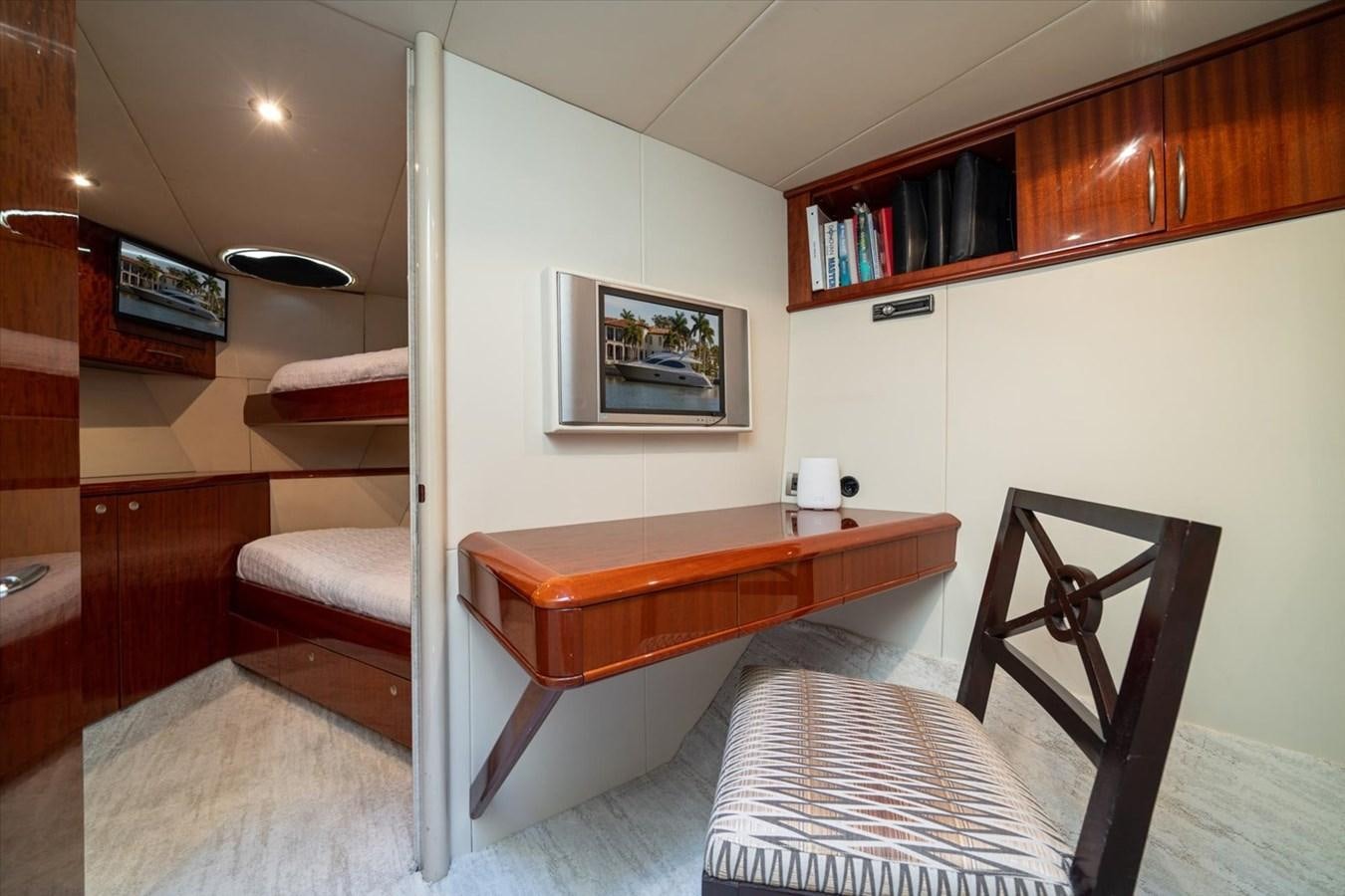 a room with a table and chairs aboard GOLDEN LADY Yacht for Sale