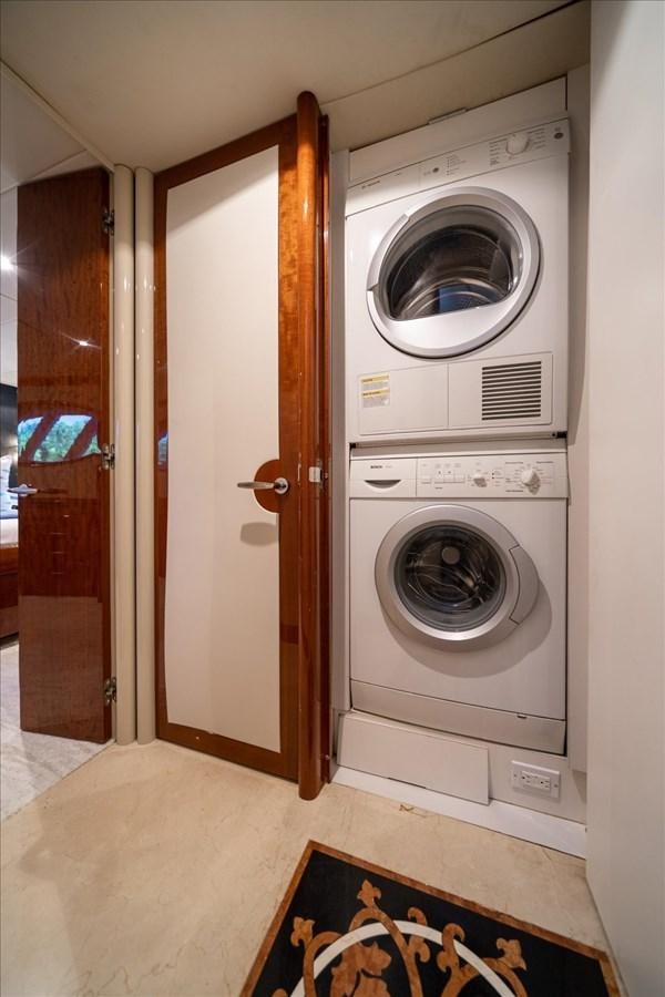 a washer and dryer in a room aboard GOLDEN LADY Yacht for Sale
