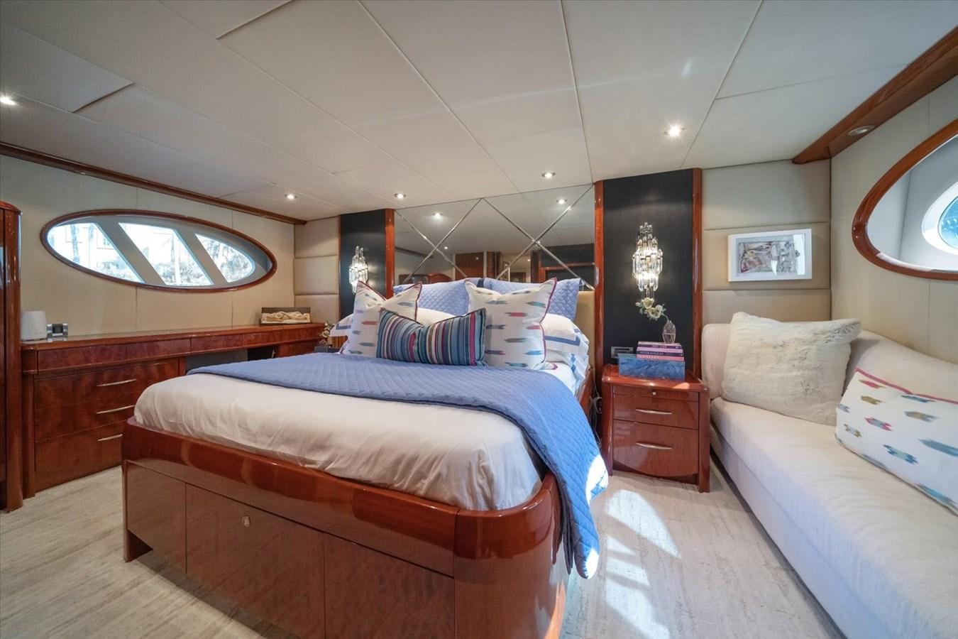 a room with a bed and a window aboard GOLDEN LADY Yacht for Sale