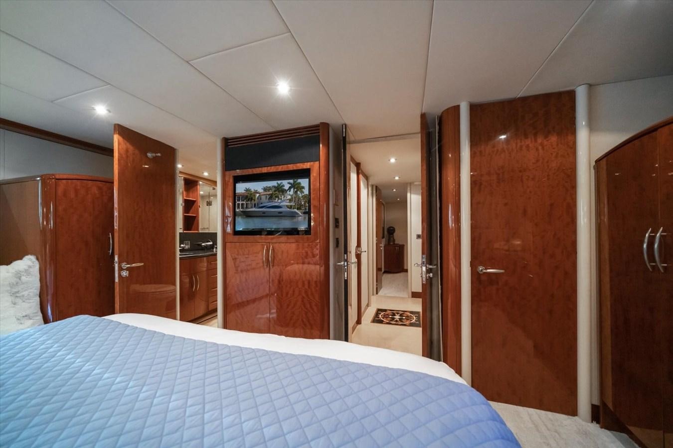 a bedroom with a bed and a door aboard GOLDEN LADY Yacht for Sale