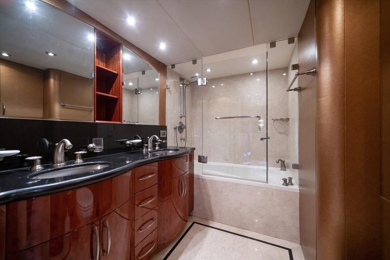 a bathroom with a large mirror aboard GOLDEN LADY Yacht for Sale