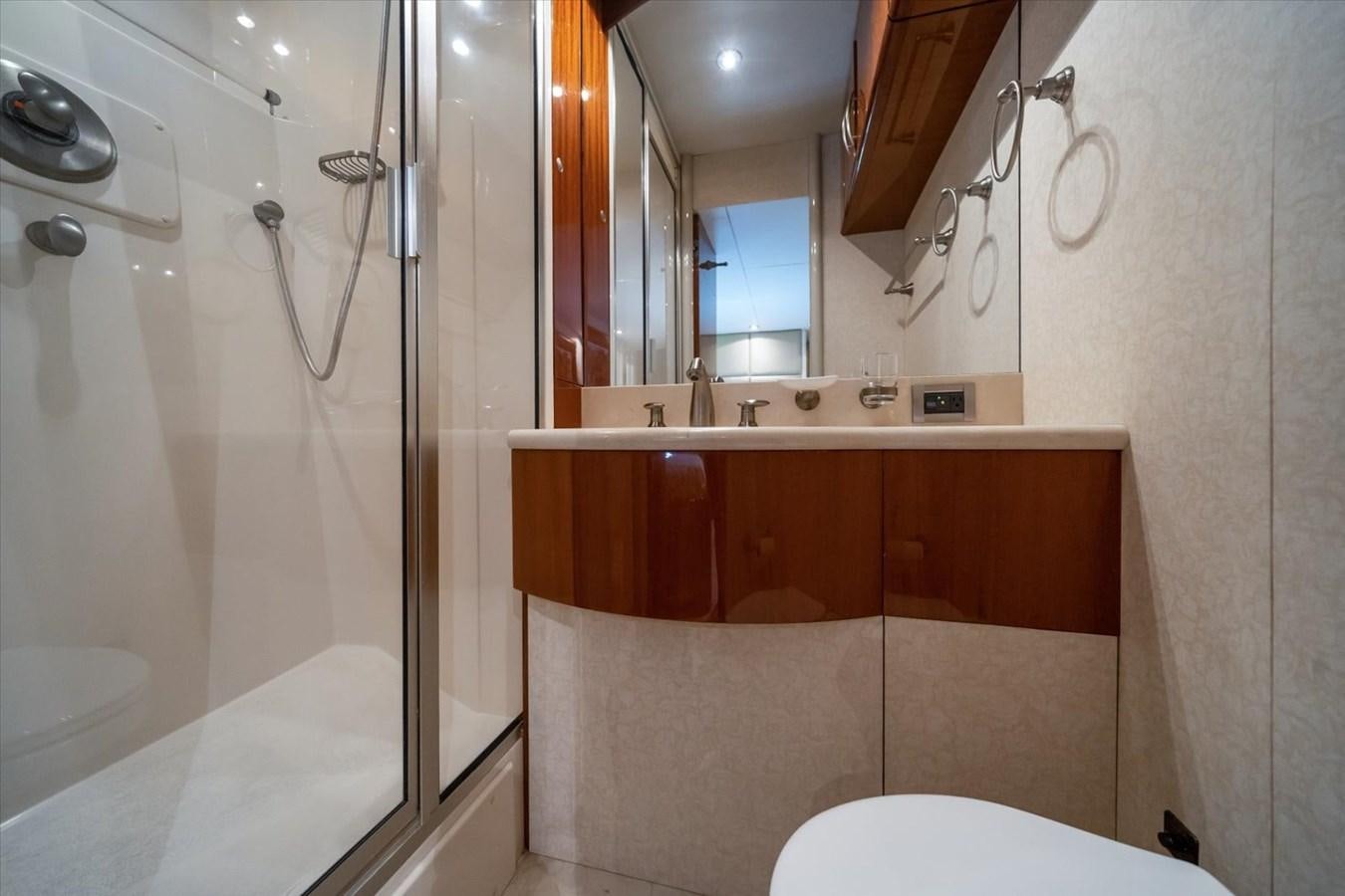 a bathroom with a bathtub and shower aboard GOLDEN LADY Yacht for Sale