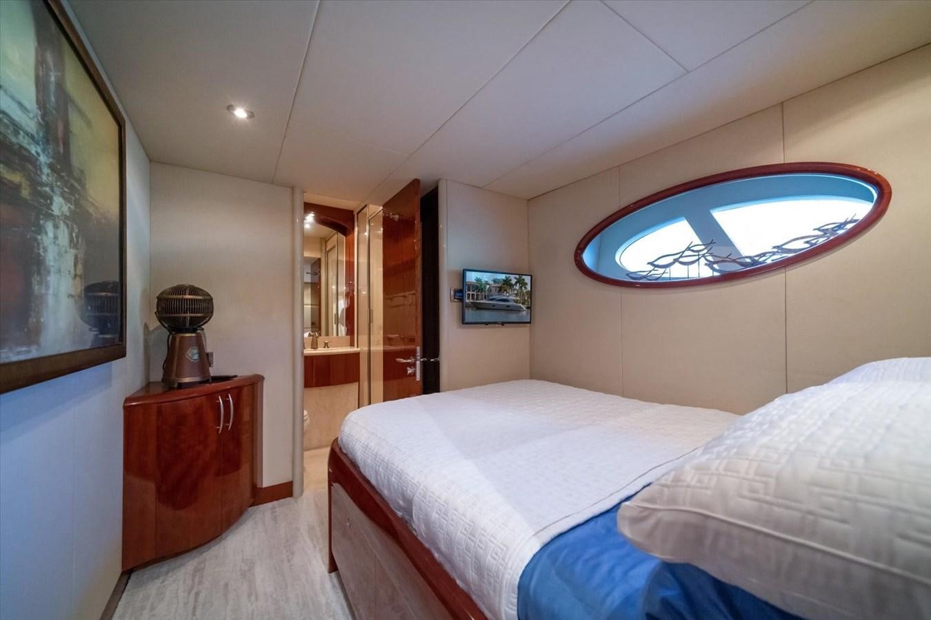 a bedroom with a large mirror aboard GOLDEN LADY Yacht for Sale