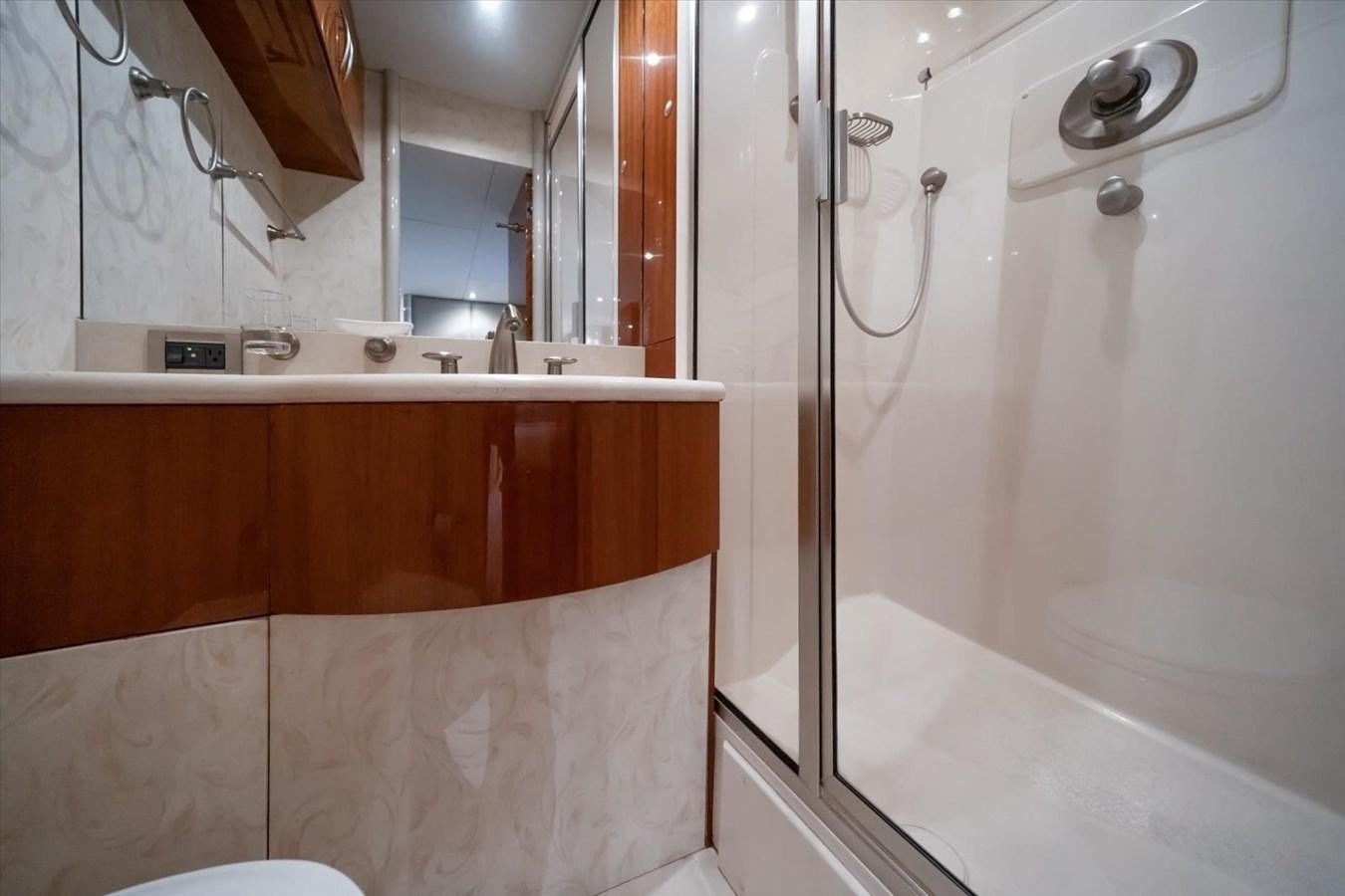 a bathroom with a bathtub and shower aboard GOLDEN LADY Yacht for Sale