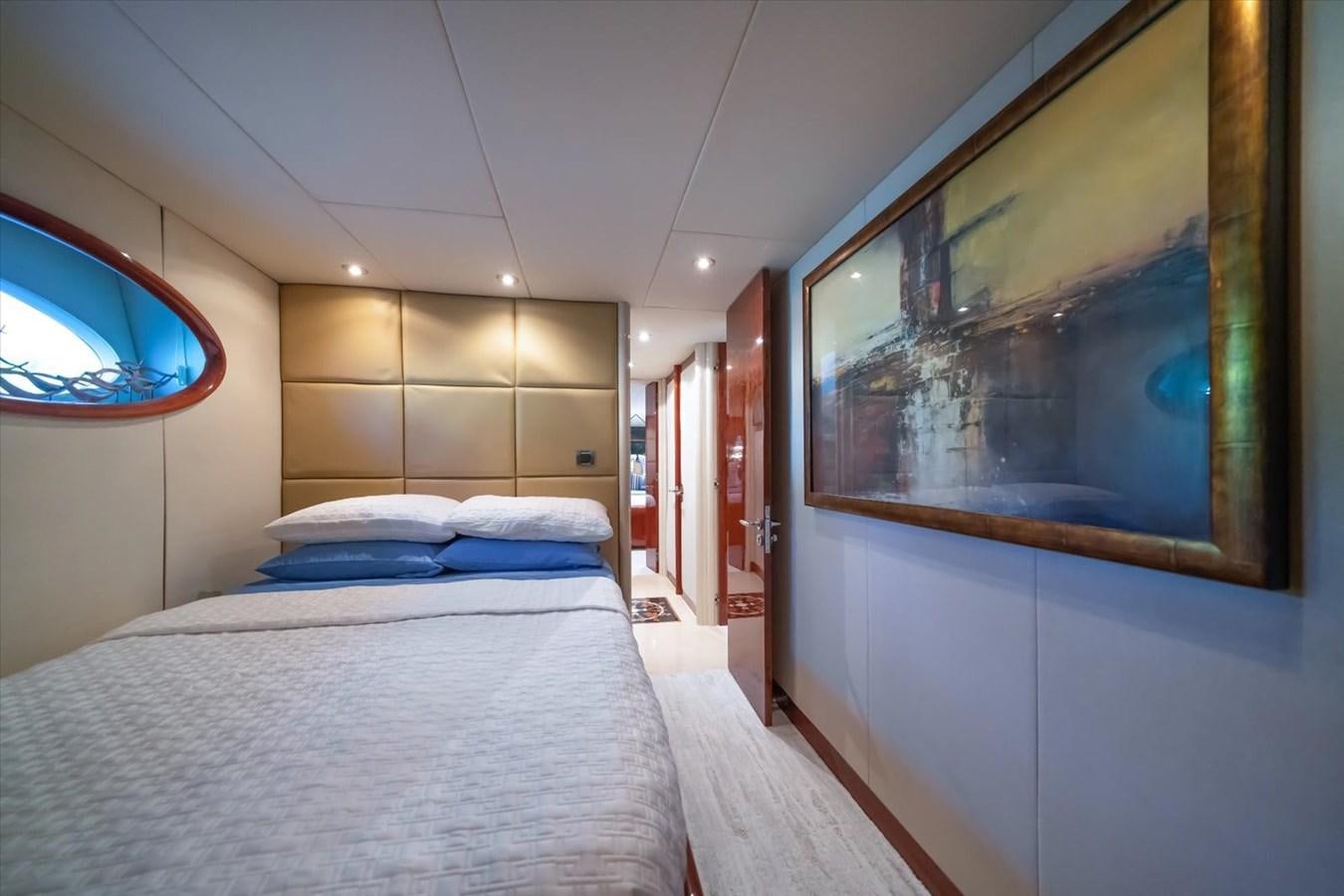 a bedroom with a large mirror aboard GOLDEN LADY Yacht for Sale