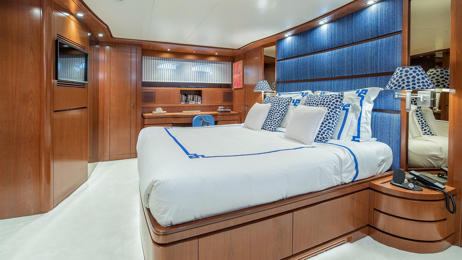 a room with a bed and a desk aboard DIAMARE Yacht for Sale