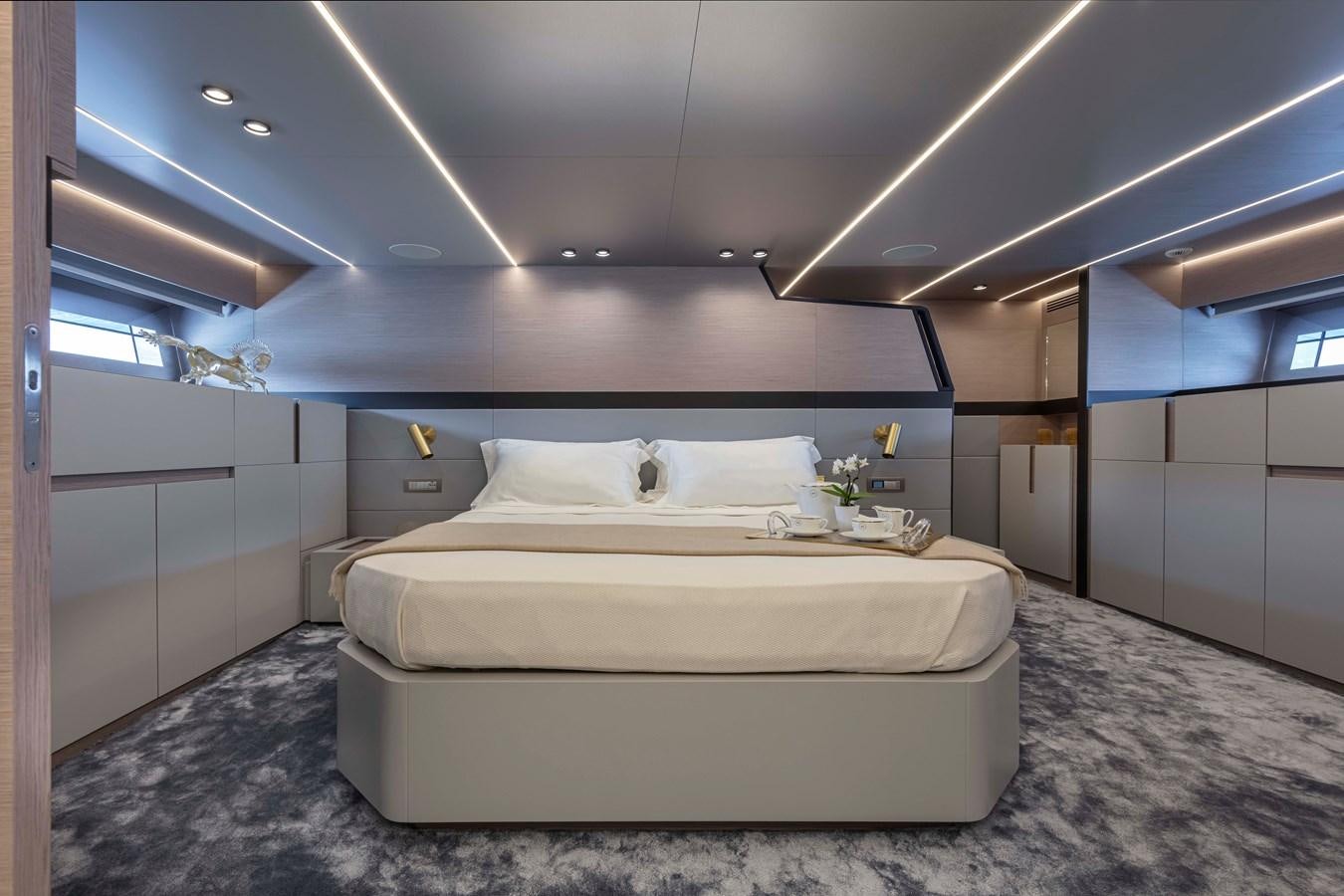 a white bed in a room aboard SONEY Yacht for Sale