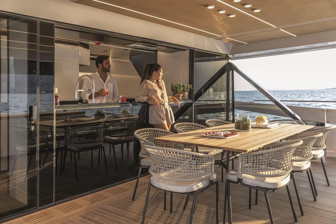 a man and woman in a restaurant aboard SONEY Yacht for Sale