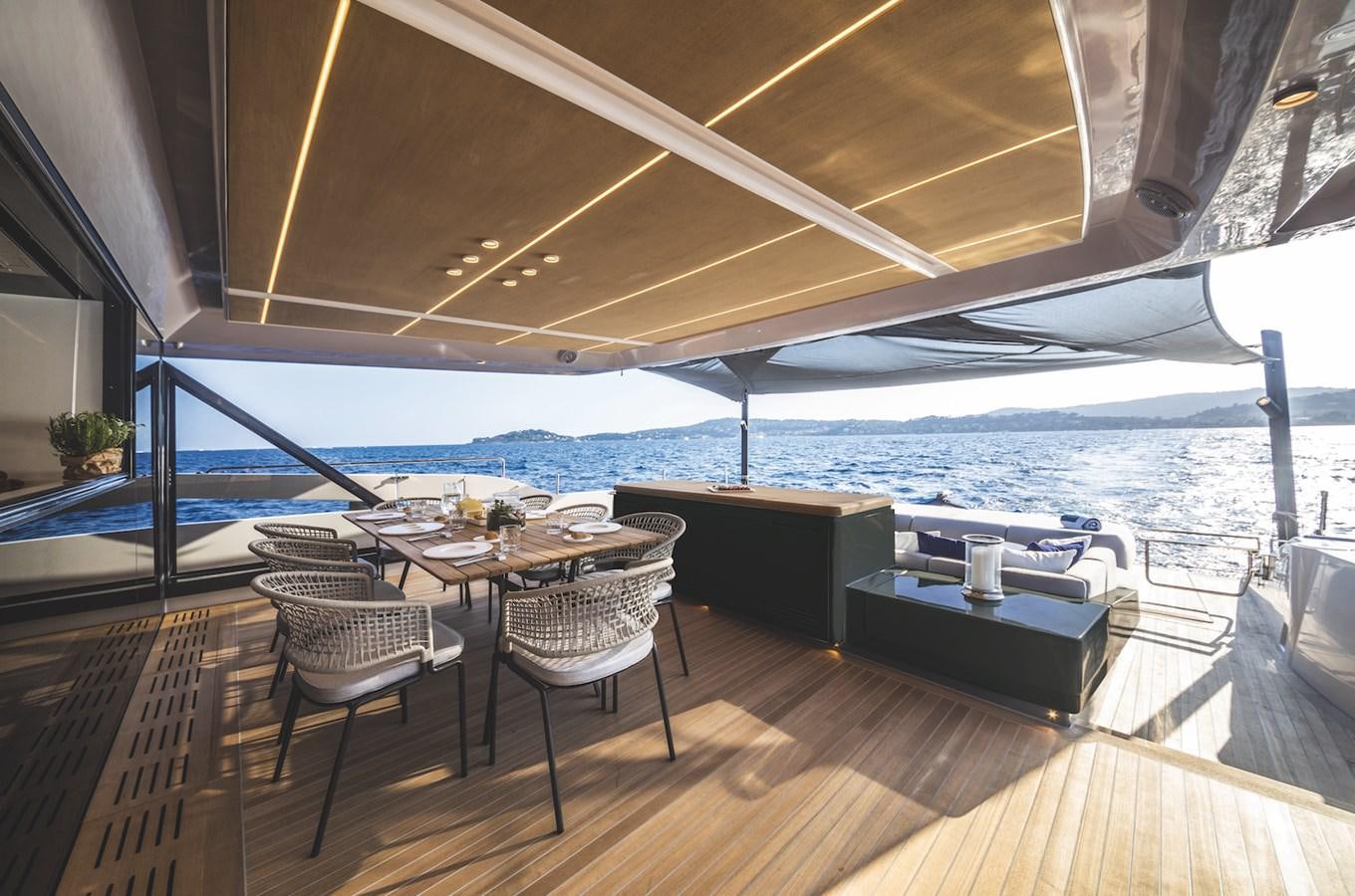 a table and chairs on a deck aboard SONEY Yacht for Sale