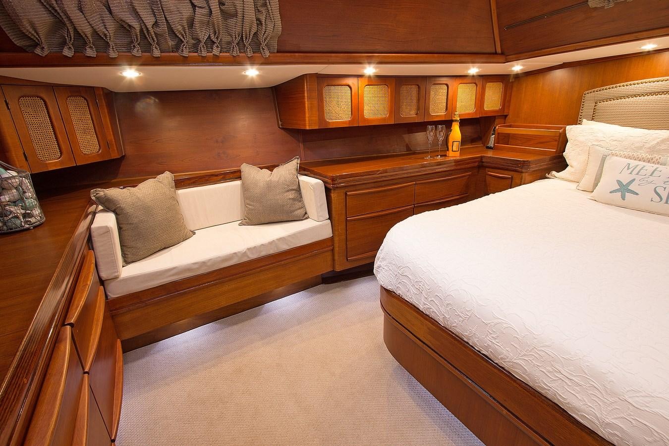 a room with wooden furniture aboard EAGLES NEST Yacht for Sale