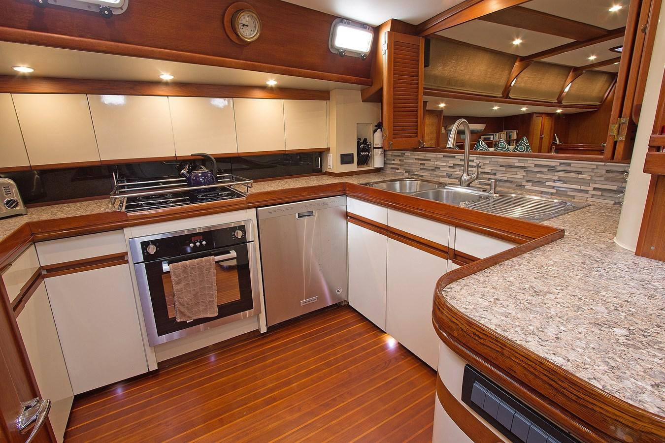 a kitchen with a stove and sink aboard EAGLES NEST Yacht for Sale