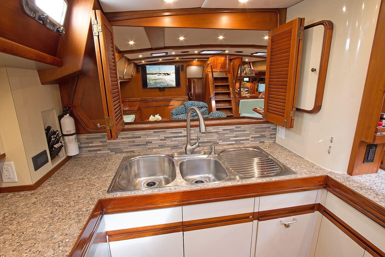 a bathroom with a sink and a mirror aboard EAGLES NEST Yacht for Sale