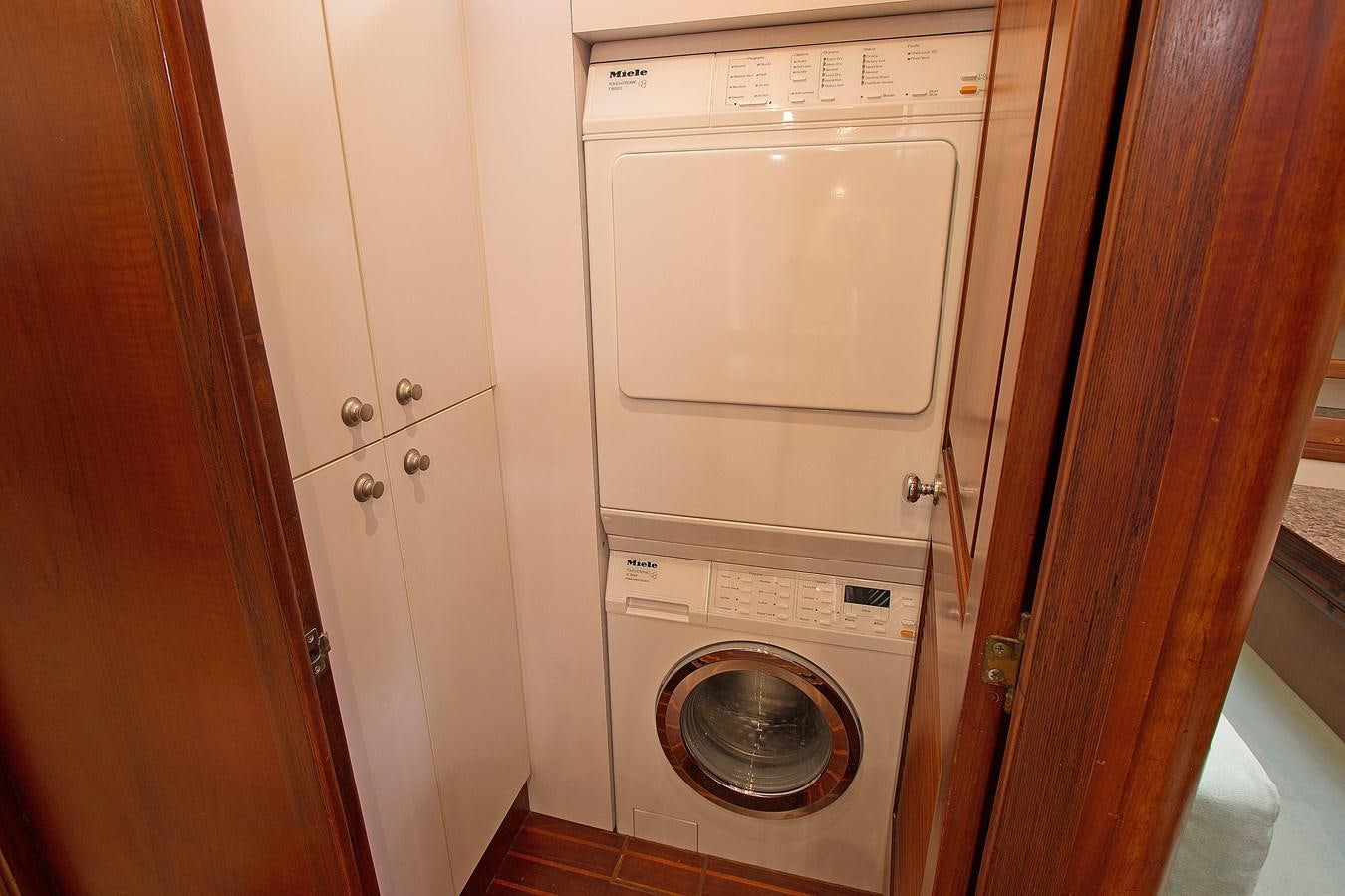 a washing machine in a closet aboard EAGLES NEST Yacht for Sale