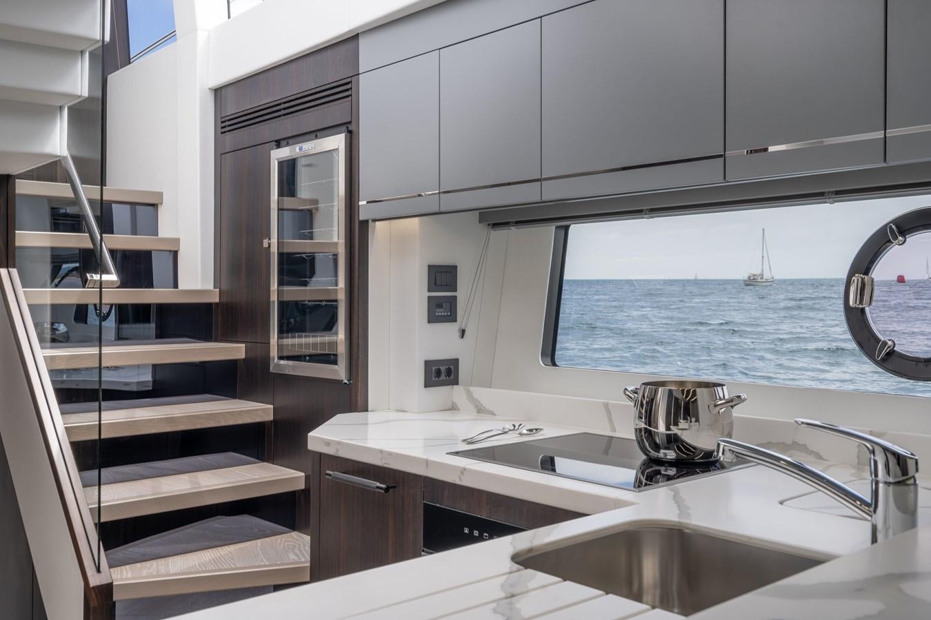 a kitchen with a sink and a large window aboard 75 SPORT YACHT Yacht for Sale